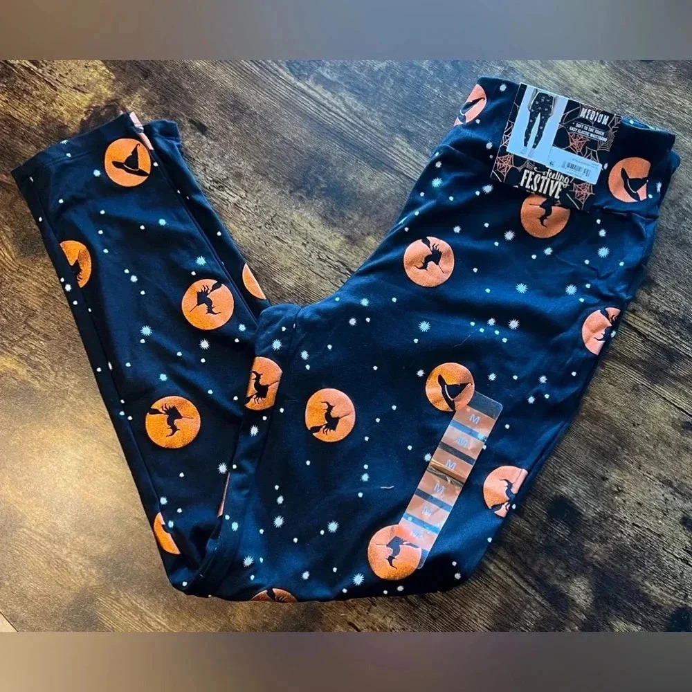Feeling Festive | ladies jet black witch hats Halloween leggings. Size: M